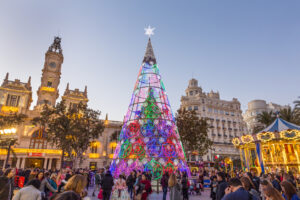 Christmas fair with colorful christmas tree and carousel 